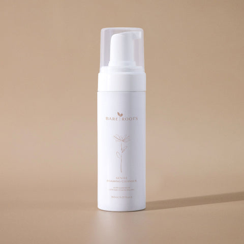 Gentle Foaming Cleanser bottle displayed against a soft beige background.
