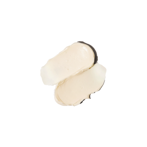 Creamy swatch of Flora Cream texture on a flat surface