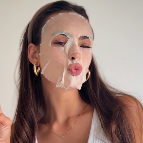 Woman with Camellia Sheet Mask applied, relaxing during use