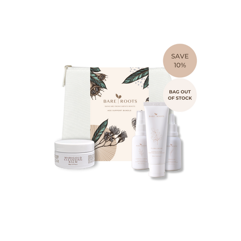 Bare Roots skincare gift set featuring a white jar of Hyalucho Balm, three white tubes and sprayers, and a decorative pouch, displayed with promotional badges on a white background.