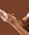 model showcasing gentle foamy texture against brown background