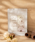 Skincare product packaging with floral design on a beige background