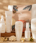 Collection of skincare products with 'Bare Roots' packaging on a wooden surface.