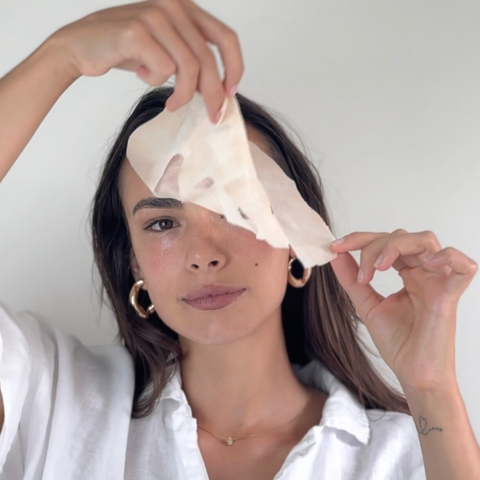Camellia Sheet Mask on womans face