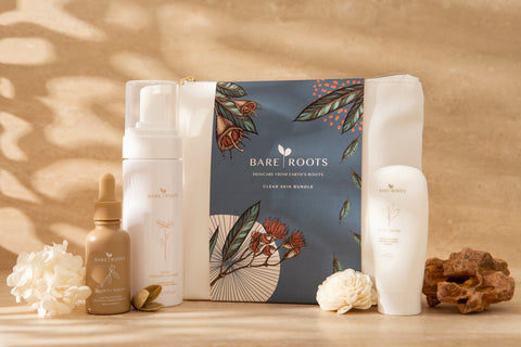Bare Roots skincare products on a wooden surface with a natural background
