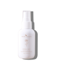 White Herbal Mist spray bottle with gold cap shown on a soft light background