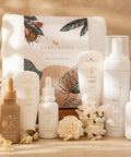 Collection of Bare Roots skincare products on a wooden surface with a warm background