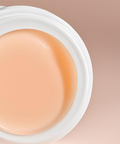 Close-up of Bare Lips lip balm showing smooth creamy texture inside the jar.