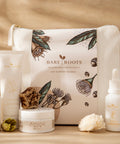 Bare Roots Age Support Bundle on natural backdrop — Marigold Balm, Curative Serum, Flora Cream, Omega Oil