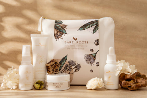 Bare Roots Age Support Bundle on natural backdrop — Marigold Balm, Curative Serum, Flora Cream, Omega Oil