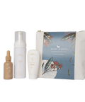 Skincare product set with bottles and a pouch on a transparent background