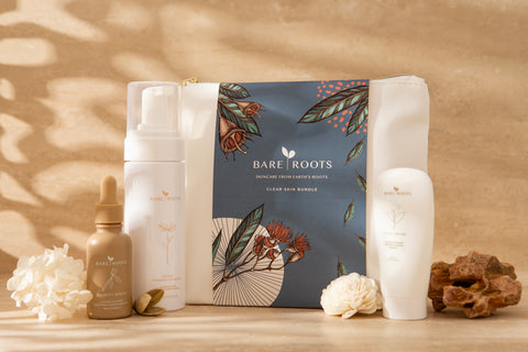 Bare Roots skincare products on a wooden surface with a natural background
