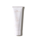 Flora Cream tube standing upright on a light neutral background