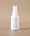 Herbal Mist bottle upright on a beige background for a clean, natural look