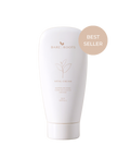 Bare Roots Vital Cream in a sleek white tube with gold cap on a neutral background.