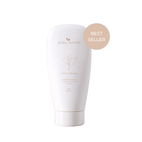 Bare Roots Vital Cream in a sleek white tube with gold cap on a neutral background.