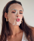 Woman with Camellia Sheet Mask applied, relaxing during use