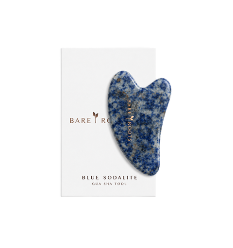 A blue and white speckled sodalite gua sha tool by Bare Roots, displayed on its white branded backing card against a clean white background.