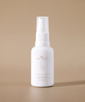 Curative Serum amber dropper bottle against a beige background.