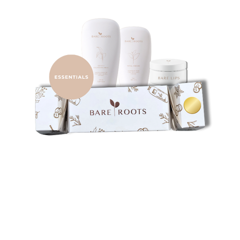 Bare Roots skincare product set with bottles and packaging on a white background