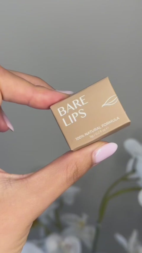 model applying bare lips to lips