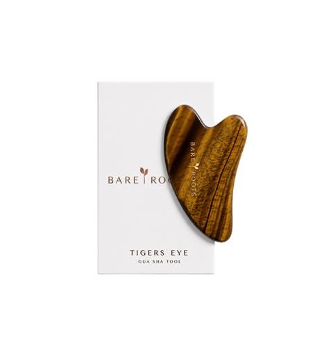 A tiger's eye gua sha facial massage tool with a natural wood grain pattern, presented on its white Bare Roots brand packaging card against a solid white background.