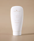 White tube of 'Bare Roots' Vital Cream on a beige background