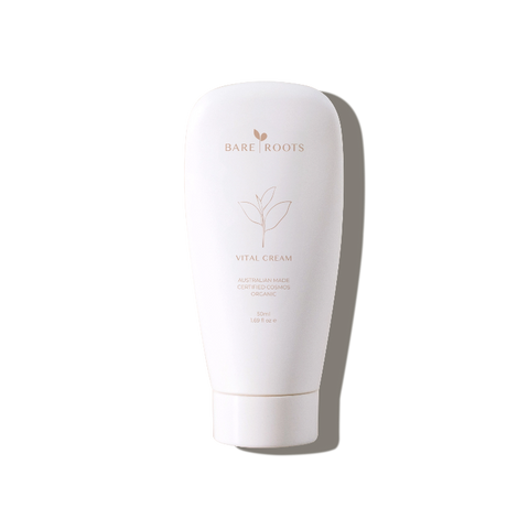 Bare Roots Vital Cream in a sleek white tube with gold cap on a neutral background.